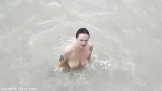 Nude Female Is Swimming In The River